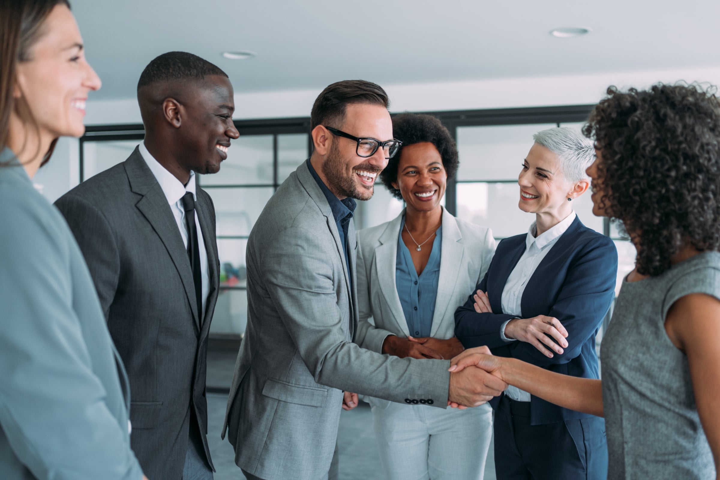 Business professionals shaking hands