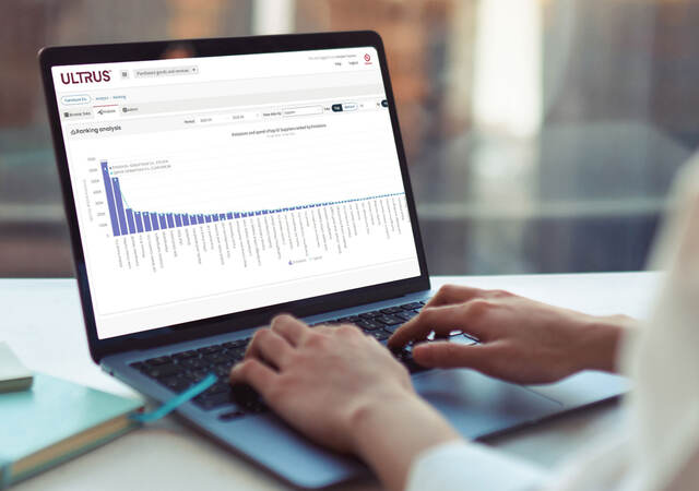 Person using ULTRUS™ Purchased Goods and Services Software module on a laptop to help determine their Scope 3 Category 1 emissions